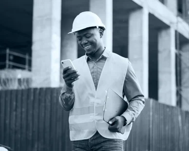 architecture-phone-inspection-with-black-man-construction-site-networking-communication-digital-engineering-building-designer-with-male-contractor-city-property-app
