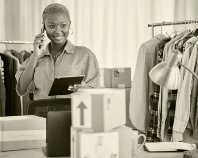 black-woman-phone-call-communication-small-business-fashion-designer-orders-boutique-happy-african-female