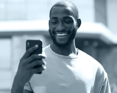 handsome-man-using-modern-smartphone-outdoors-e1737996090106