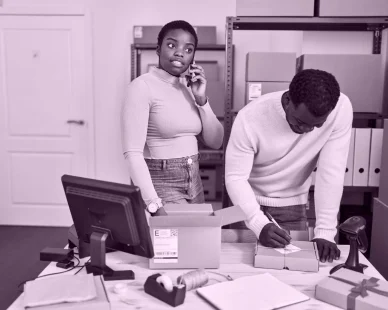 man-woman-ecommerce-business-workers-talking-smartphone-office