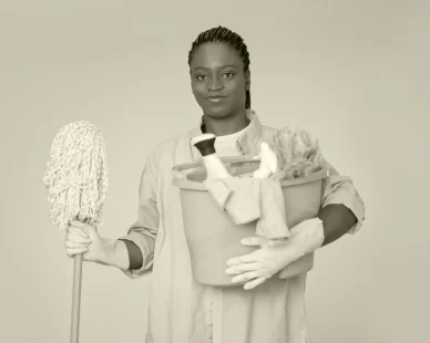 portrait-black-woman-housekeeper-holding-basket-with-cleaning-tools