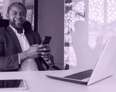 portrait-senior-gray-haired-african-american-boss-man-smiling-looking-camera-workplace-e1738075276703