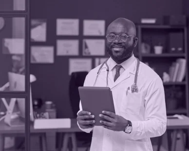 professional-black-physician-posing-his-workplace