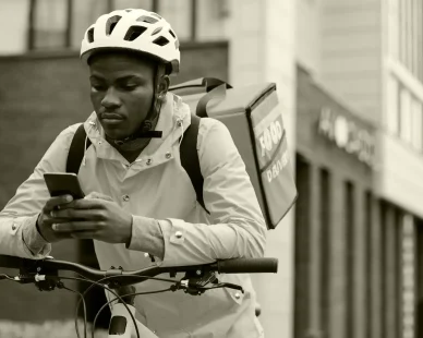 serious-black-man-uniform-worker-food-delivery-service-e1738057706992