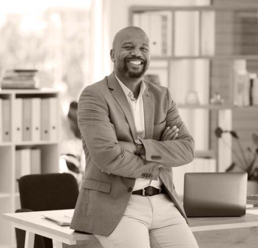 success-corporate-leadership-portrait-black-man-sitting-desk-modern-office-startup-management-marketing-ceo-happy-male-entrepreneur-with-business-vision-creative-workplace-1-768x556